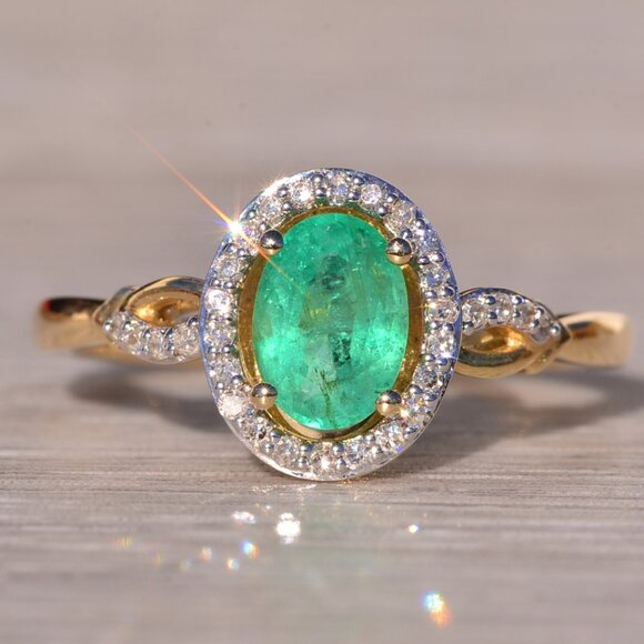 Emerald and Natural Diamond Halo Ring in Yellow Gold